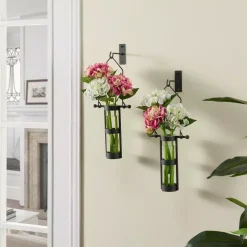 DANYA B Urbanne Rustic Black Metal Wall Mount Hanging Glass Cylinder Decorative Vases (Set Of 2)